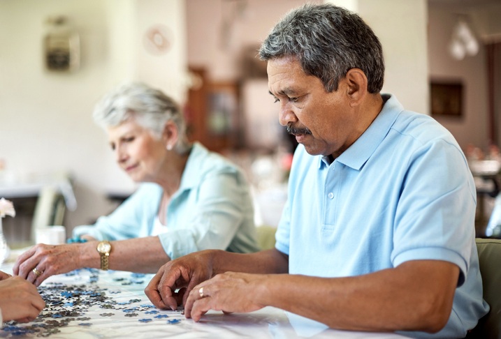 Senior residents building a puzzle during occupational therapy in a Spring Lake Skilled Nursing and Rehabilitation