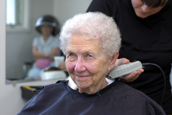 Nursing and Rehabilitation Activities in Spring Lake LA as senior enjoys haircut at care facility