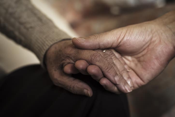 Caregiver supporting a resident in dementia care