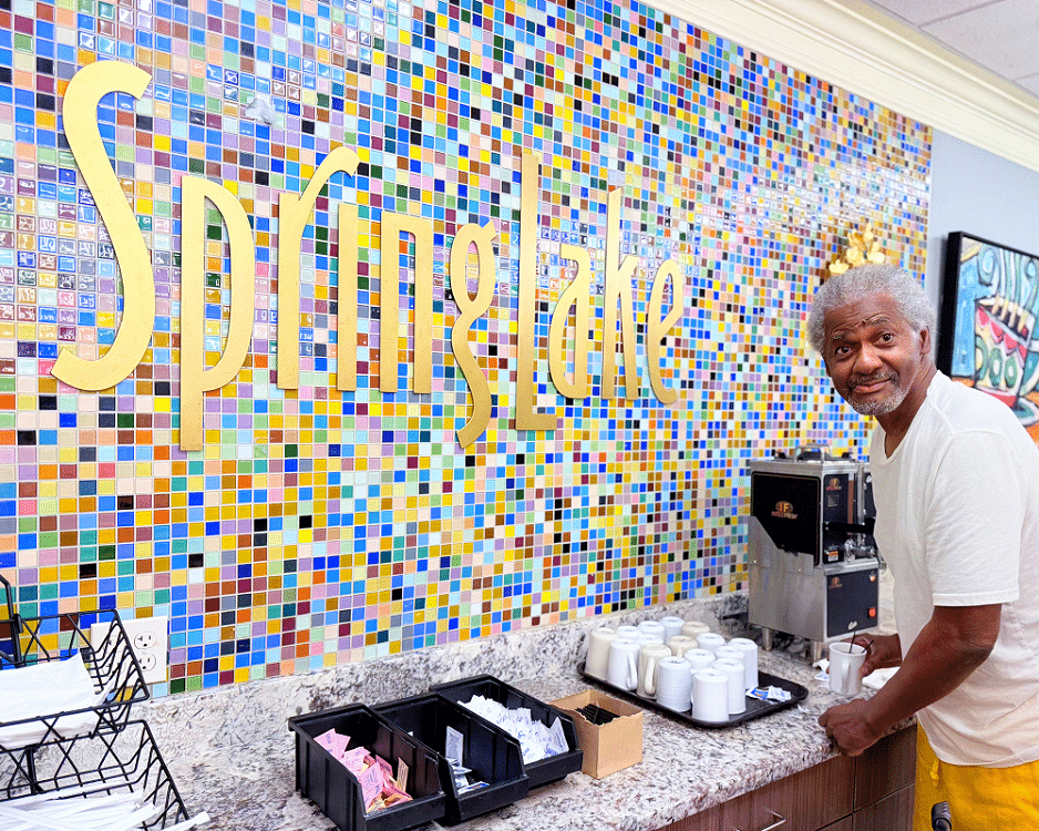 Resident enjoying a drink at the coffee bar