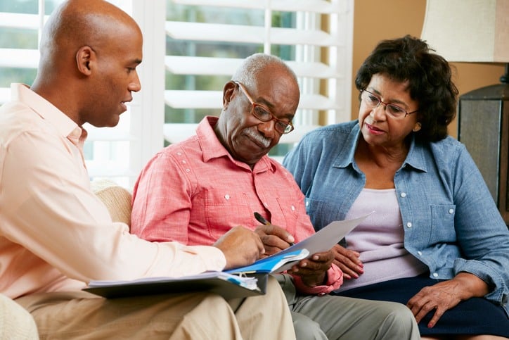 Senior couple touring a care facility