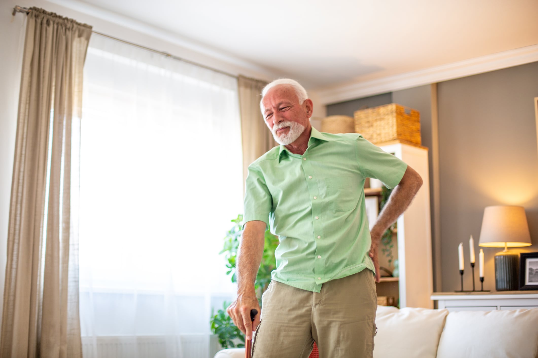 Senior receiving pain management treatment